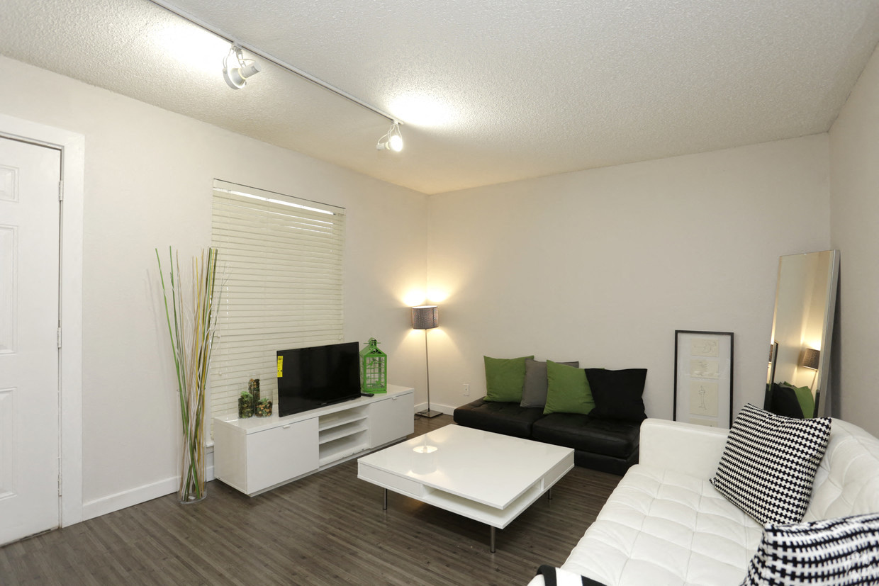a living room with a white couch and a table